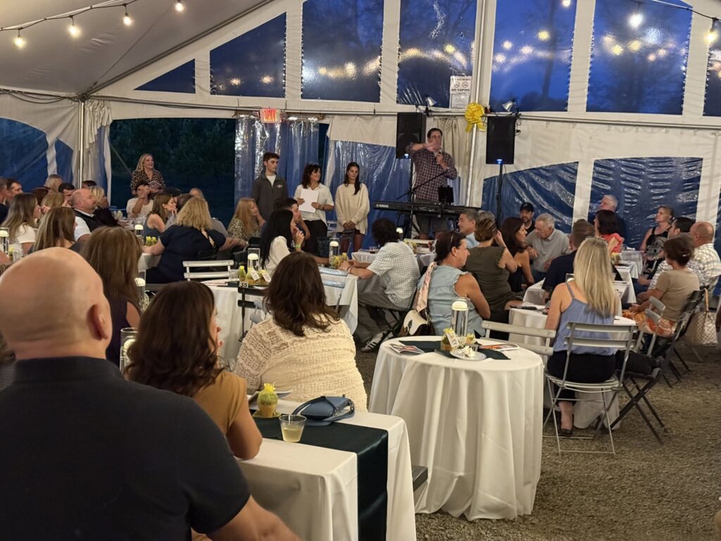 Guests at a private event under the Vineyard Tent at Old York Cellars