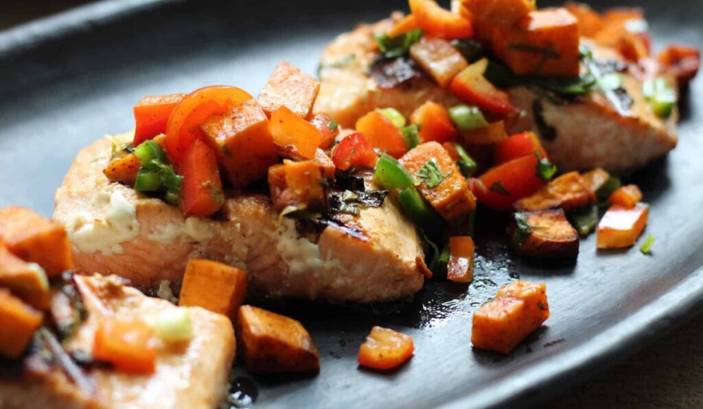 Close‑up of a plated entrée topped with diced vegetables and herbs served at Old York Cellars.