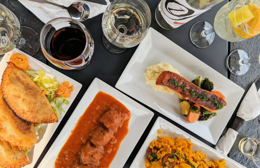 Five‑course wine pairing dinner at Old York Cellars in Ringoes, Hunterdon County, NJ, featuring plated seasonal dishes arranged with multiple wine pours on a white‑clothed table.