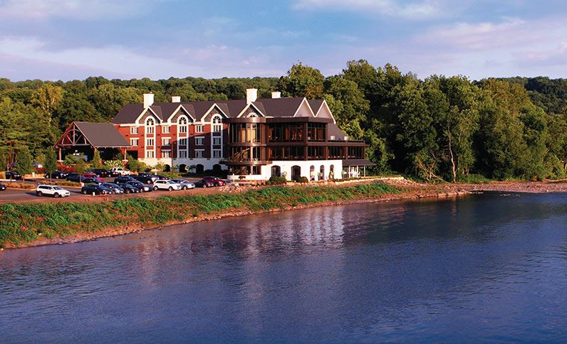 Lambertville Station Inn overlooking the Delaware River with scenic views.