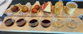 Spanish meats and cheeses with six wines from your choice of four self‑guided tasting flights. A next‑level experience.