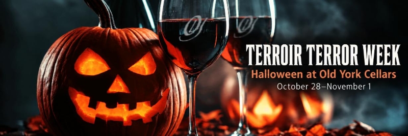 Glowing jack‑o’‑lantern beside two glasses of red wine on a dark, smoky background with autumn leaves scattered around; text reads “Terroir Terror Week – Halloween at Old York Cellars, October 28–November 1.”